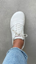 Load image into Gallery viewer, White Icarus Ascent barefoot shoe on a concrete surface, top-down view showing the profile of the toebox

