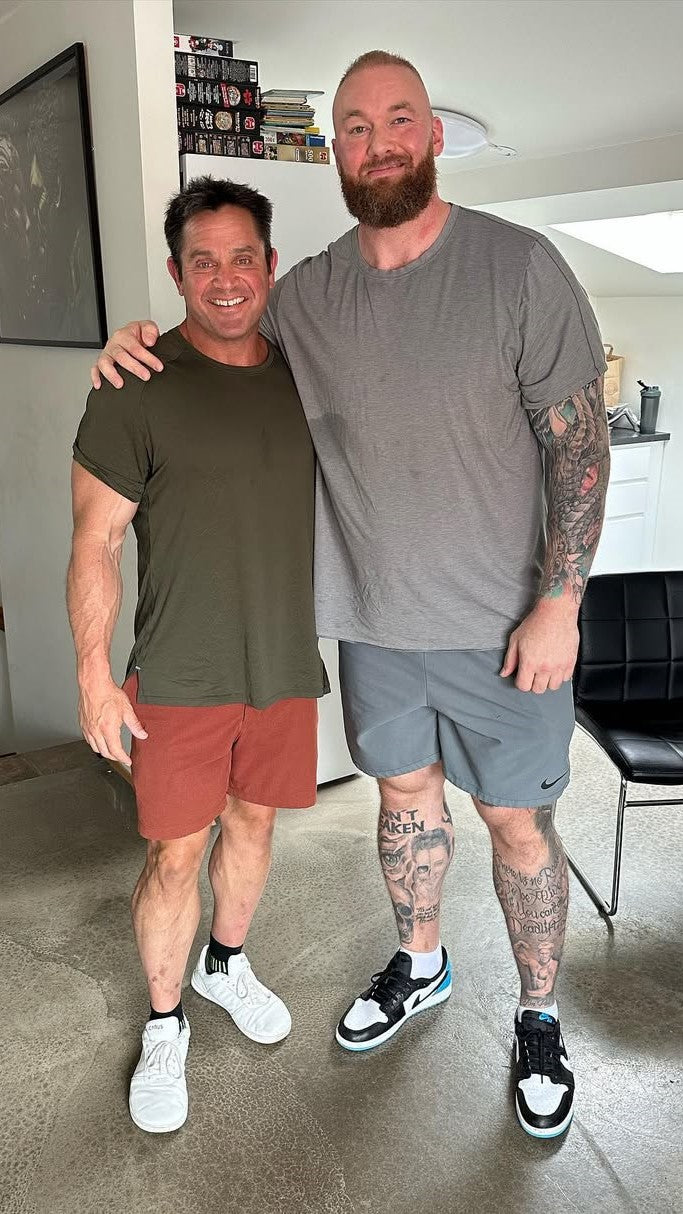 Mark Bell posing with Thor Bjornson wearing Icarus Ascent Gen 2 sneakers (white/red colorway)